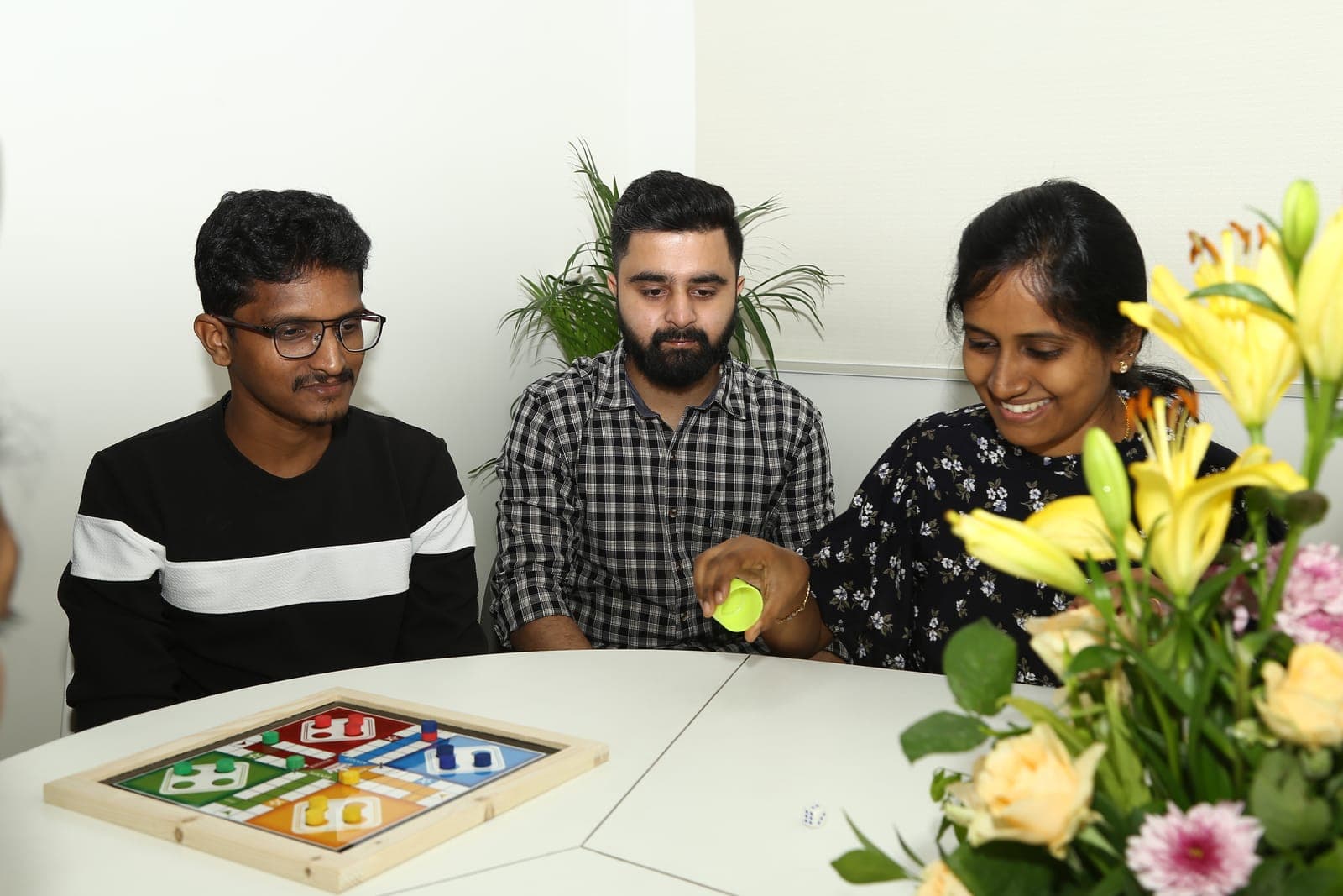 Two teammates deep in a board game